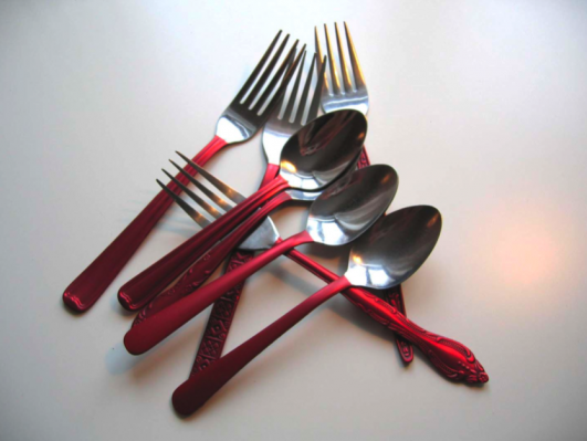Cutlery Pieces with Red Handles by Anne Marchand part of 'Continuity in Diversity'